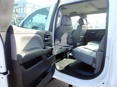Chevrolet Silverado 5500HD truck interior view with front passenger seat and open rear door.