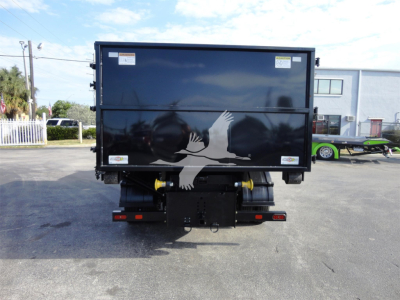 Truck bed of a new 2023 Chevrolet Silverado 5500HD rolloff dump with graphic design on tailgate showing white hands reaching; rear view with bumper and hitch.