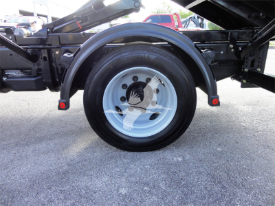 Wheel and adjacent frame of a 2023 Chevrolet Silverado 5500HD chassis showing a Continental tire and fender mudguard.