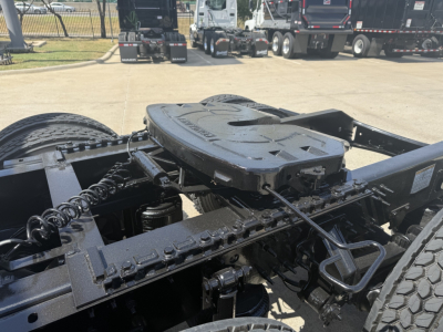 Volvo VNL64T860 chassis and fifth wheel area with drive components and cables visible