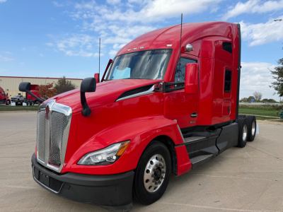 Kenworth T680 sleeper cab truck side view with red paint and black bumper.