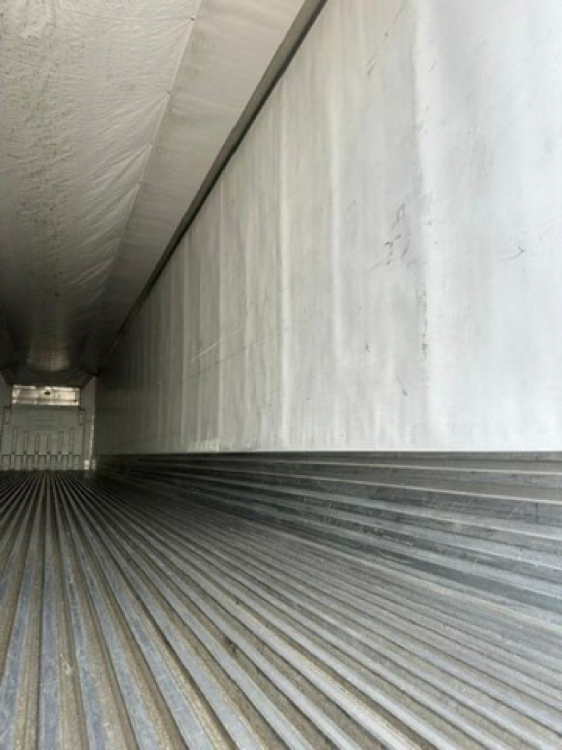 Trailer interior showing ribbed metal floor and sidewall panels inside a 2016 refrigerated trailer.