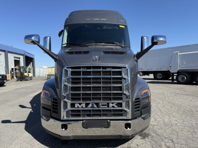 Front view of a new 2027 Mack AN64T64 conventional sleeper truck showing grille with MACK letters and large bumper.