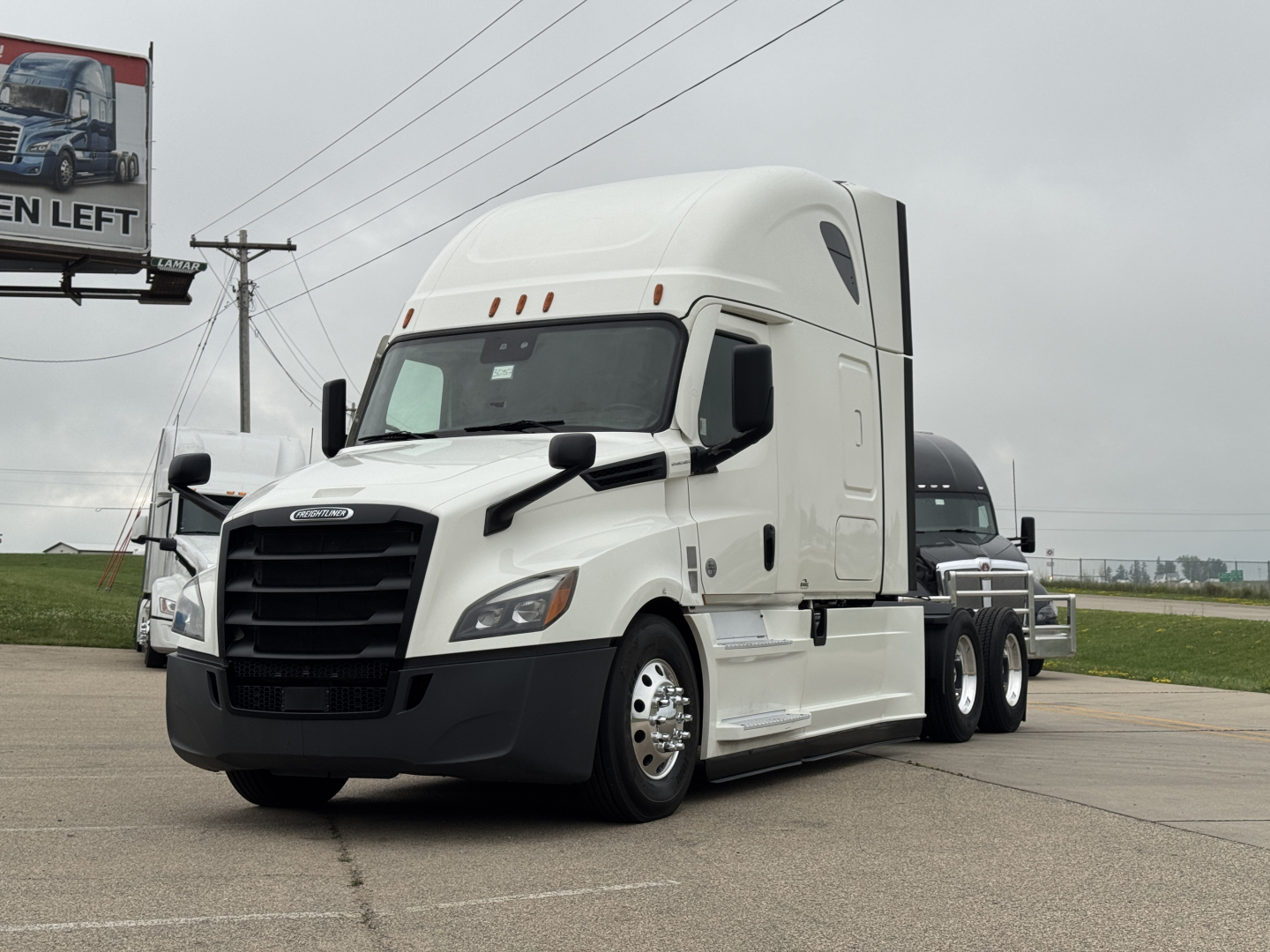 Truck image: 2021 Freightliner Cascadia 126 conventional sleeper, white, three-axle tractor with large black grille, side mirrors, and aerodynamic hood side panels. No visible text readable.