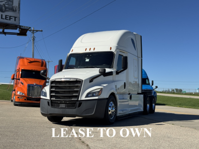 White 2021 Freightliner Cascadia 126 semi-truck in a dealership lot, front and side view, ‘LEASE TO OWN’ text overlaid in white.