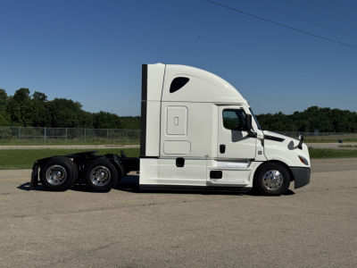 Freightliner Cascadia 126 tractor in side profile view showing sleeper cab, white exterior, dual rear axles, and chrome wheels.