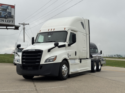 Truck image: 2021 Freightliner Cascadia 126 conventional sleeper, white, three-axle tractor with large black grille, side mirrors, and aerodynamic hood side panels. No visible text readable.