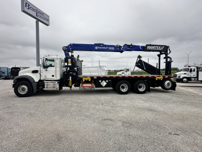 Truck-mounted tow/haul crane on Mack GR64F cab and chassis showing Manitex crane and hydraulic boom