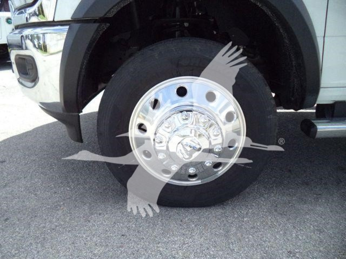 Wheel close-up on Ram 4500 SLT chassis showing steel hub and tire, front wheel assembly.