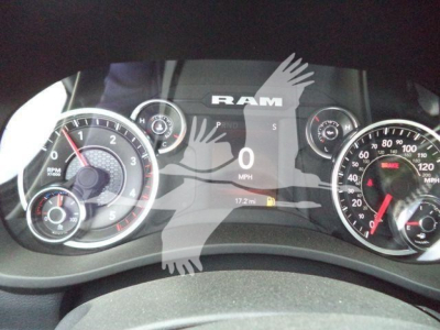 Ram instrument cluster with large RAM logo overlaying dashboard, showing 0 mph, 17.2 mi, and various gauges.