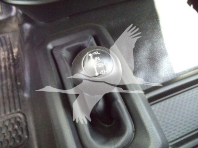 Four-wheel drive transfer case shift knob showing 4L 4H N and 2H markings inside a Ram 4500 cabin.