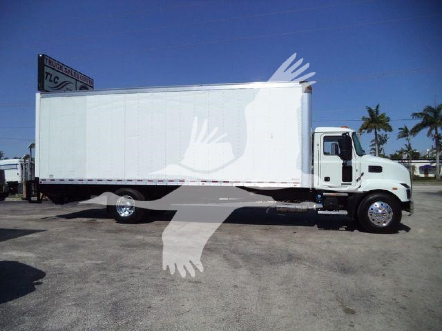 Box truck side view showing a white Mack MD6 box truck with cab and cargo area, stock MD6BOX26 label in listing.