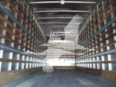 Box truck interior with empty cargo area and wooden floor, side rails, and metal framing. Overlay watermark with eagle/logo.