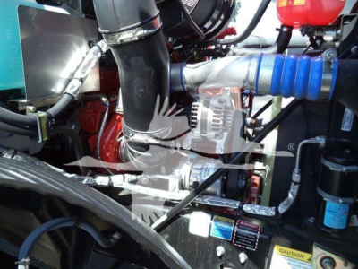 Mack MD6 engine bay showing blue intercooler hose and various hoses and components