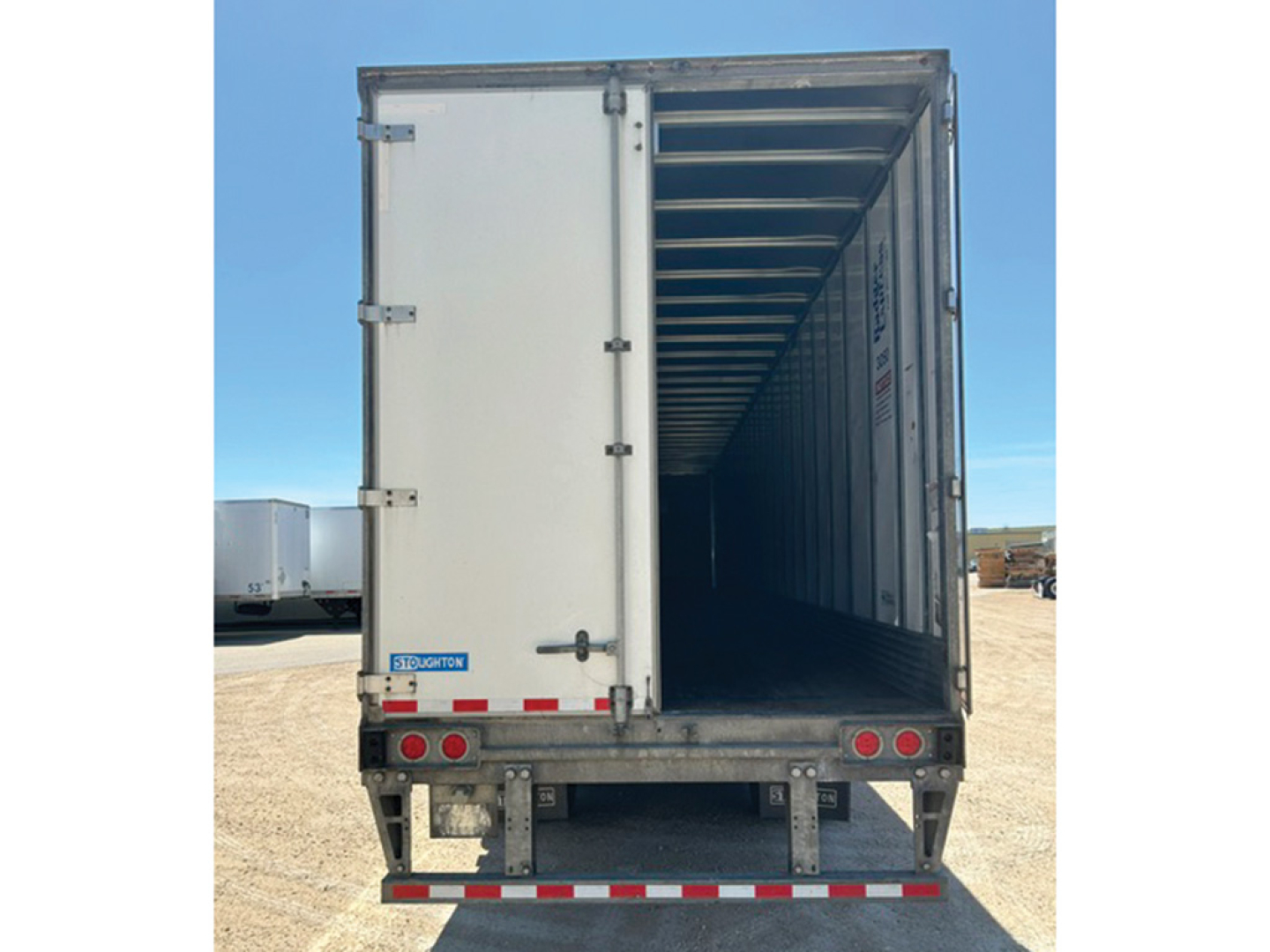 Trailer rear view showing empty interior of a 2018 Stoughton box trailer with open rear doors