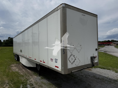 Trailer side view showing 53' dry van trailer with rear doors and stock ID 7705 on an open lot.