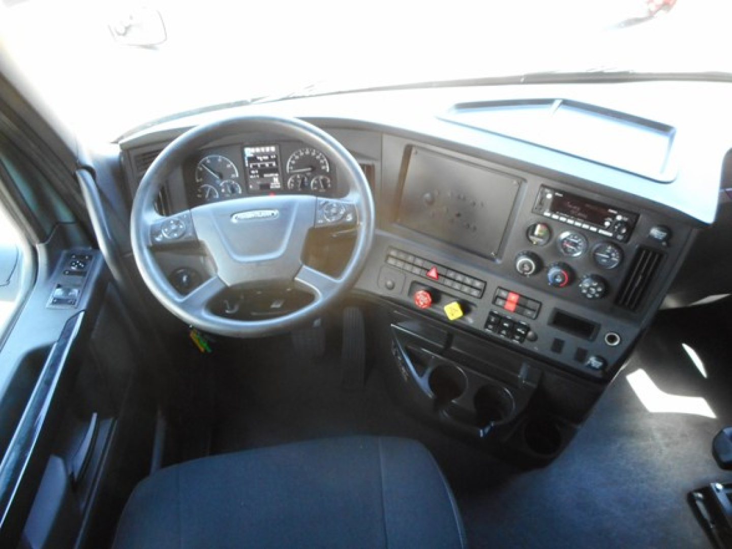 Dashboard of Freightliner Cascadia 126 steering wheel and instrument cluster visible