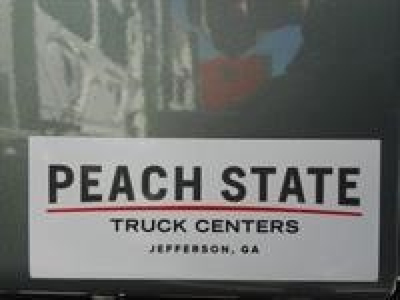 Brake tag? Not present. View of Peach State Truck Centers label on a truck part area. Text visible: PEACH STATE TRUCK CENTERS JEFFERSON, GA.