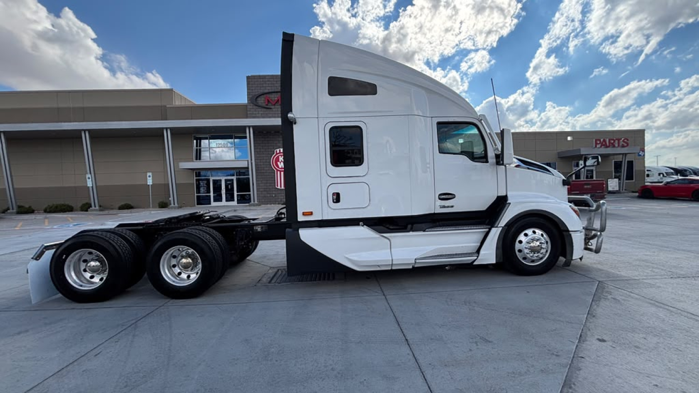 Kenworth T680 conventional sleeper truck in-profile showing cab and rear axle assembly.