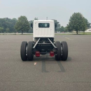 Chassis of a 2027 Hino L6 cab chassis truck viewed from rear showing dual rear axles and license plate area with a small cab.