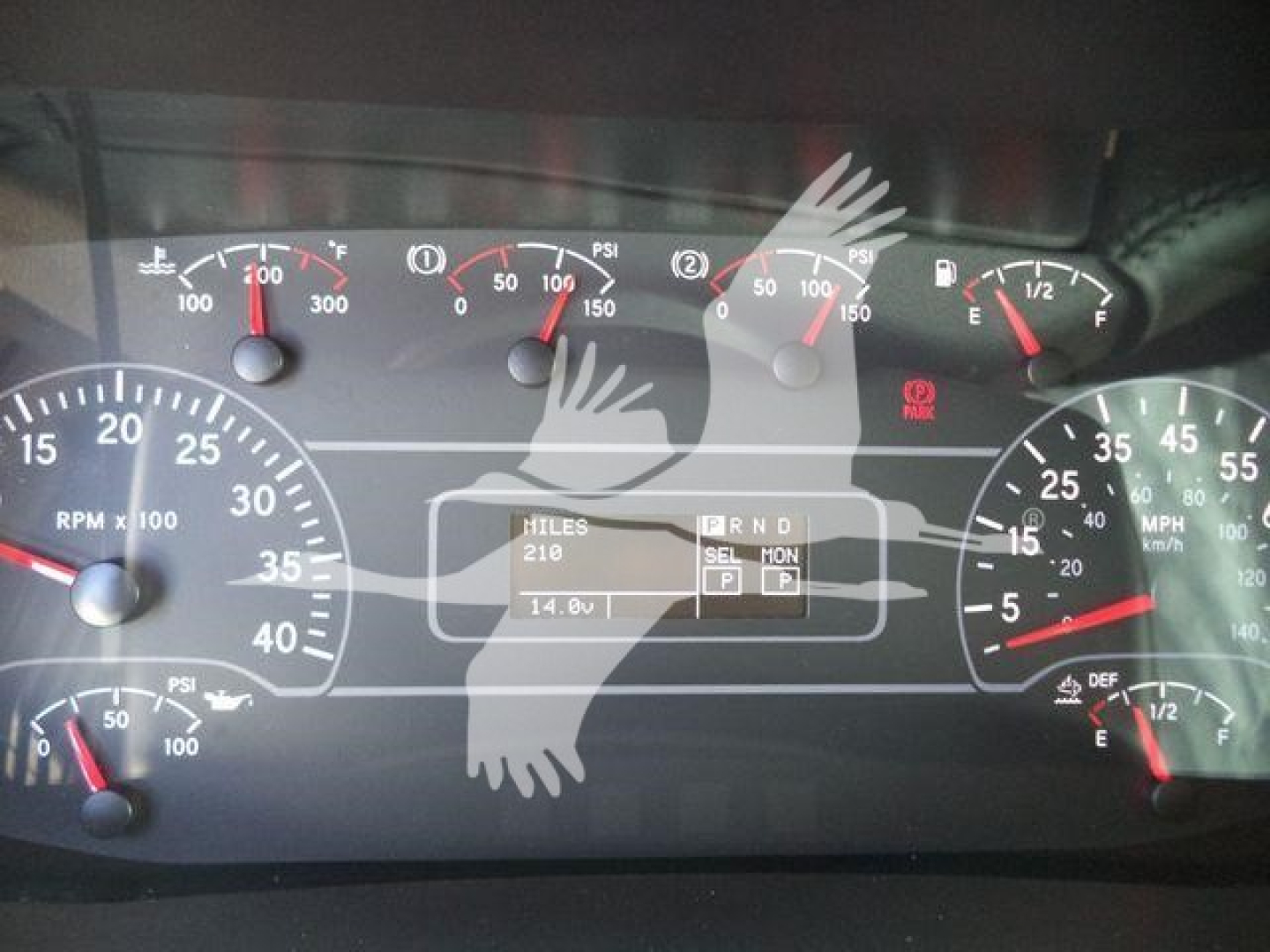 Dashboard of a 2025 International MV winch truck showing gauges and central digital display with miles and gear indicator.