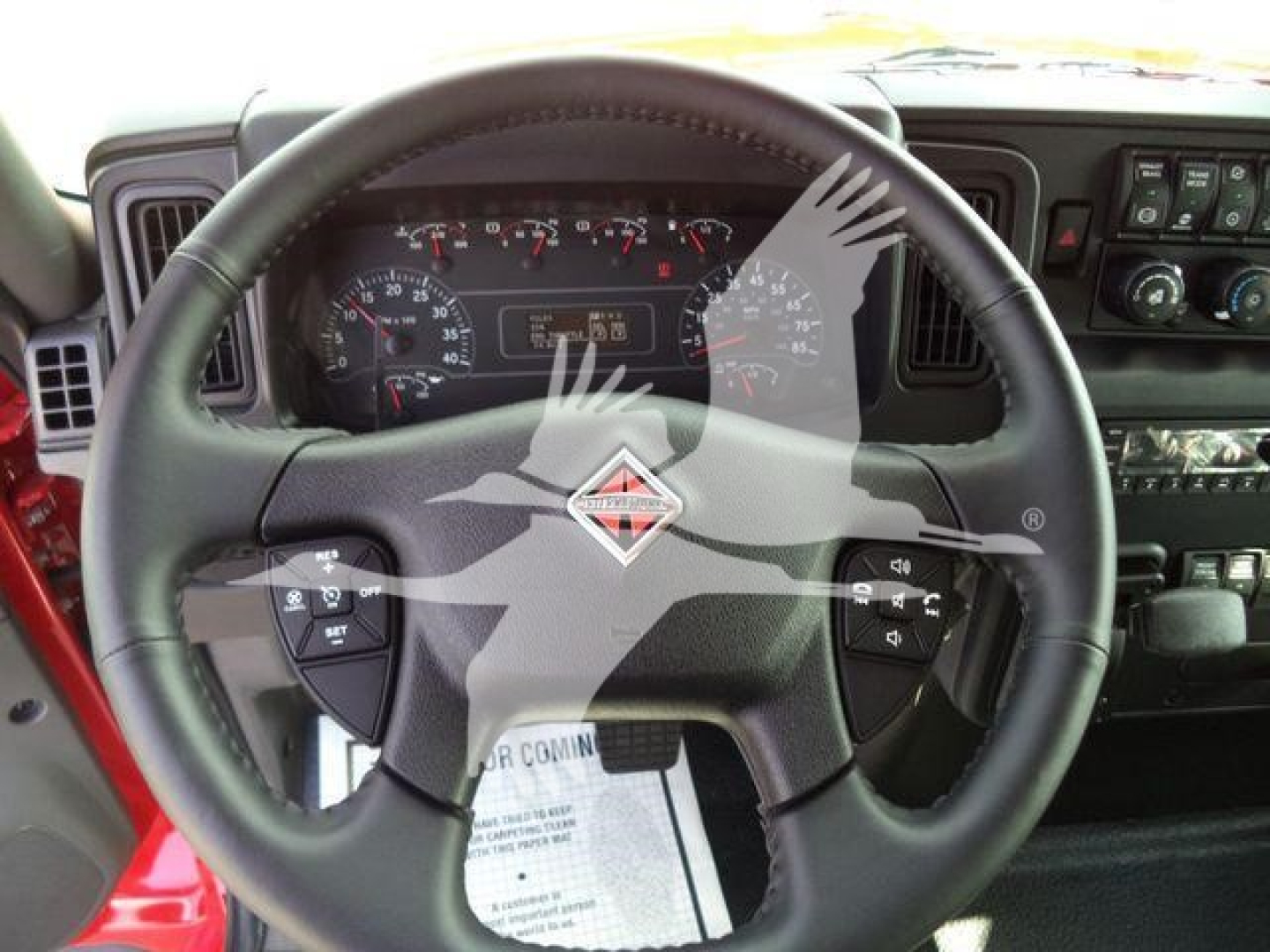 steering wheel and cockpit of a new 2025 International MV truck with instrument cluster, controls, and dashboard visible