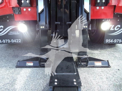 Winch-equipped 2025 International MV truck front view showing hitch and lifting mechanism.