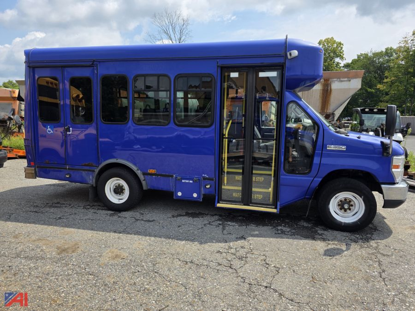 Blue 2018 Ford E-Series passenger bus shown in side and front view with open front door and steps.