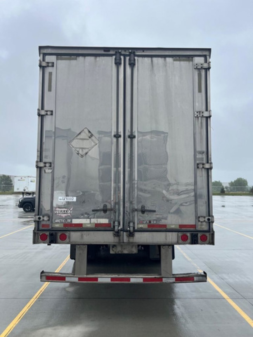 Trailer rear of a 2014 Wabash Reefer refrigerated trailer showing double doors, rear lights, bumper, and reflective tape. Includes stock number U91110 and VIN area on doors.