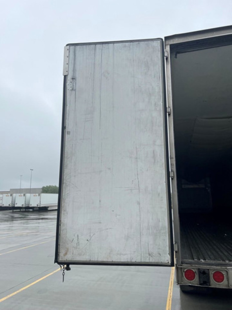 Reefer trailer door open showing interior cargo area of a 2014 Wabash refrigerated trailer.