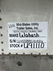 Plate on trailer showing Make-Wobash logo and S/N 1JJV532B9EL811526, Stock U91110, 2014 Mid-States Utility Trailer Sales label.