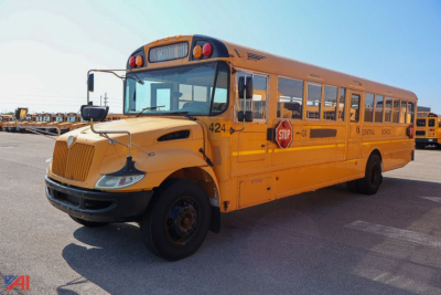 School bus CE Series 2015 IC Corporation bus shown from front-left angle, yellow body with stop sign and bus numbers visible.