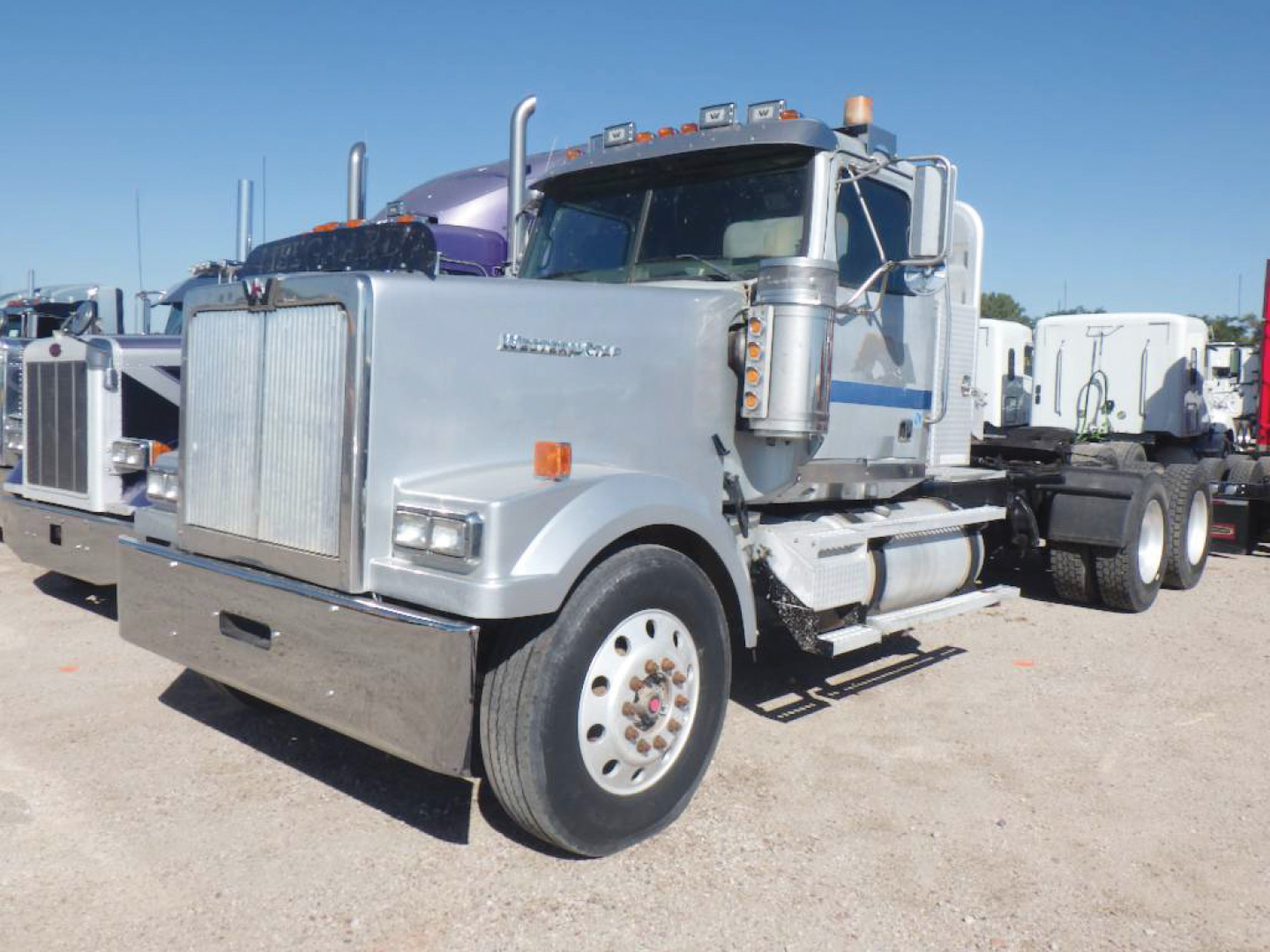 Semi tractor in-service 2008 Western Star 4900EX Daycab truck showing front grille, chrome bumper, dual exhaust stacks, and large tires.