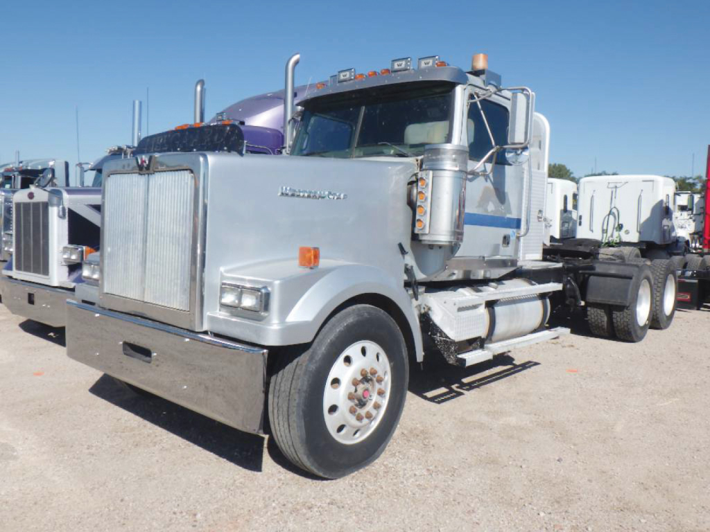 Semi tractor in-service 2008 Western Star 4900EX Daycab truck showing front grille, chrome bumper, dual exhaust stacks, and large tires.