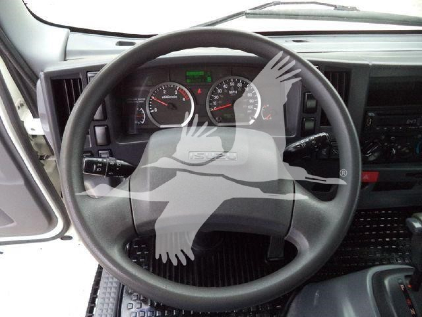Isuzu NPR-HD truck interior steering wheel with dashboard gauges visible