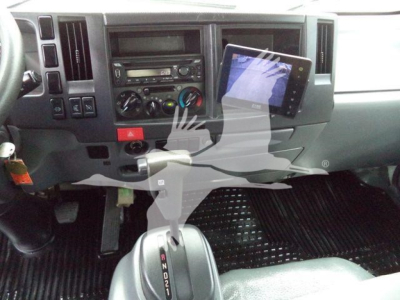 Isuzu NPR-HD truck interior showing dashboard, center console, and gear shifter.