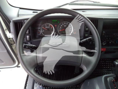 Isuzu NPR-HD truck interior steering wheel with dashboard gauges visible