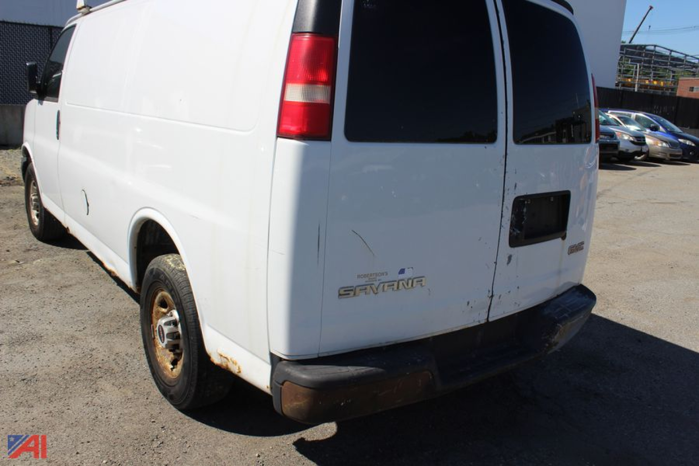 GMC Savana cargo van rear view showing tail lights and emblem