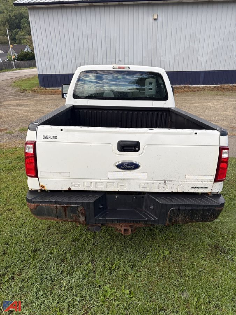 Ford F-350 Super Duty pickup bed with tailgate, rear view showing Super Duty lettering, Ford emblem, and rear bumper.