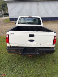 Ford F-350 Super Duty pickup bed with tailgate, rear view showing Super Duty lettering, Ford emblem, and rear bumper.