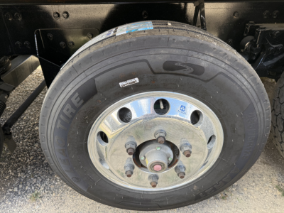 Peterbilt truck wheel with tire and rim visible; no legible text other than 'TIRE' on the tire sidewall.