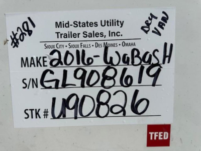 Sign on a used trailer with handwritten inventory details: makes label 'Mid-States Utility Trailer Sales, Inc.' and entries 'Make 2016-Wabash', S/N GL908619, STK # U90826, TFED note, handwritten 'Deep Van'