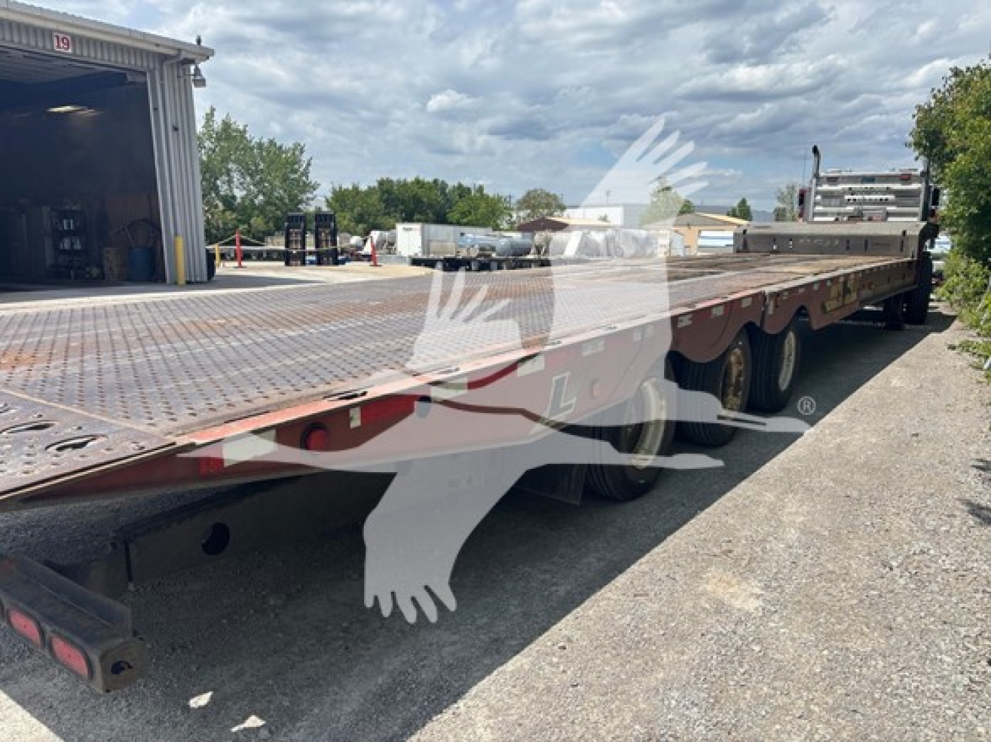 Landoll 950C traveling axle trailer showing flatbed and dual rear axles with ramp; VIN 1LH950UJ2F1C22054 stock 7456.