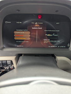 Peterbilt 579 dashboard display showing Systems Check screen with 13 of 13 issues, warning indicators, and vehicle status Readouts.