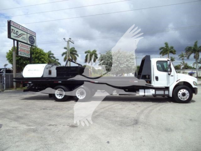 Freightliner M2 106 roll-off truck with long flatbed and roll-off container, side view showing cab and chassis.