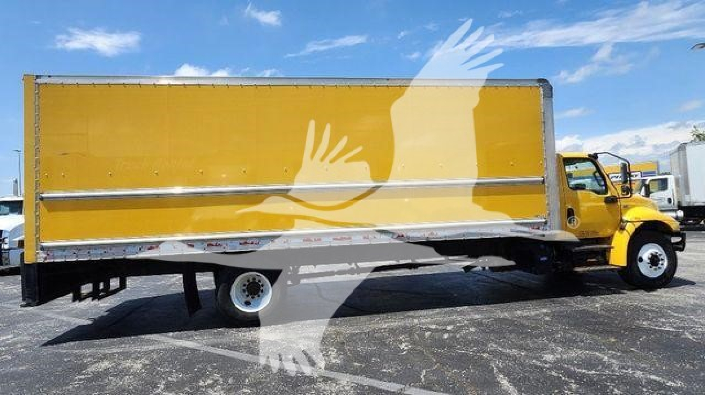 Box truck side view showing yellow cargo box and International MV cab, VIN 3HAEUMML3ML543093, stock T43093, used 2021 model.
