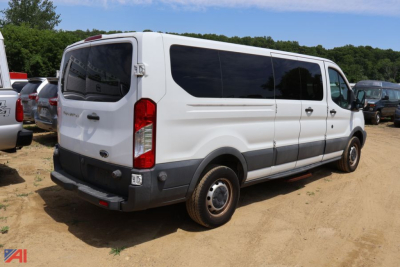Ford Transit 350 cargo van rear view showing side and back with black trim and tinted windows.