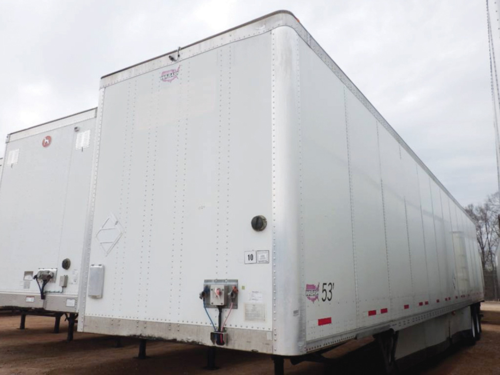 Trailer side showing 53' length marking and rear trailer doors with latching mechanism and inspection labels.