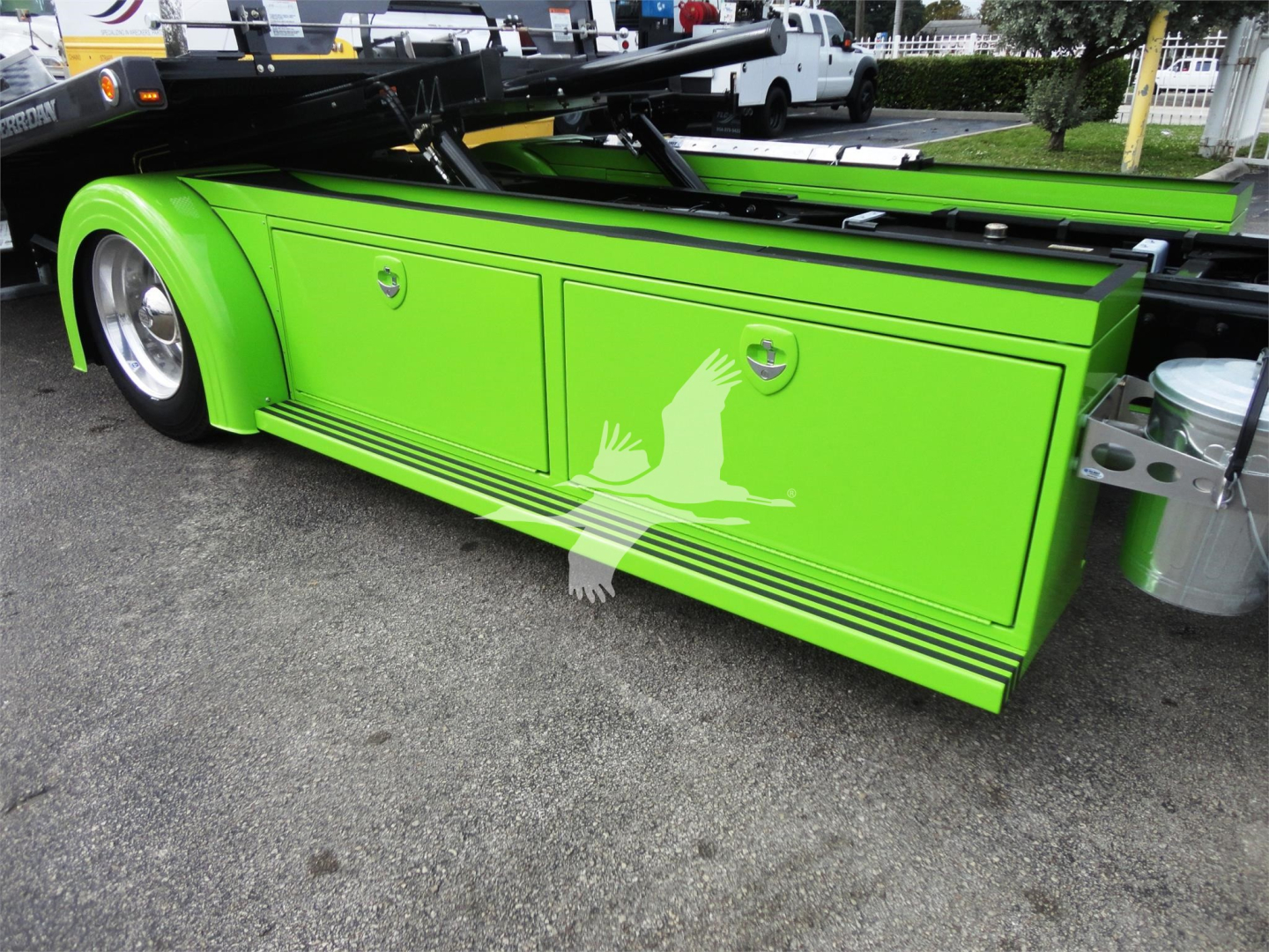 Green Peterbilt 337 rollback truck side panel with black trim and chrome accents