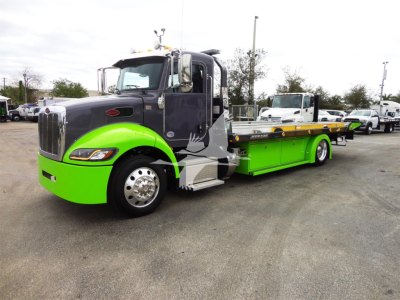 Peterbilt 337 rollback tow truck in lime green and dark gray, side view with long flatbed and chrome front grille.